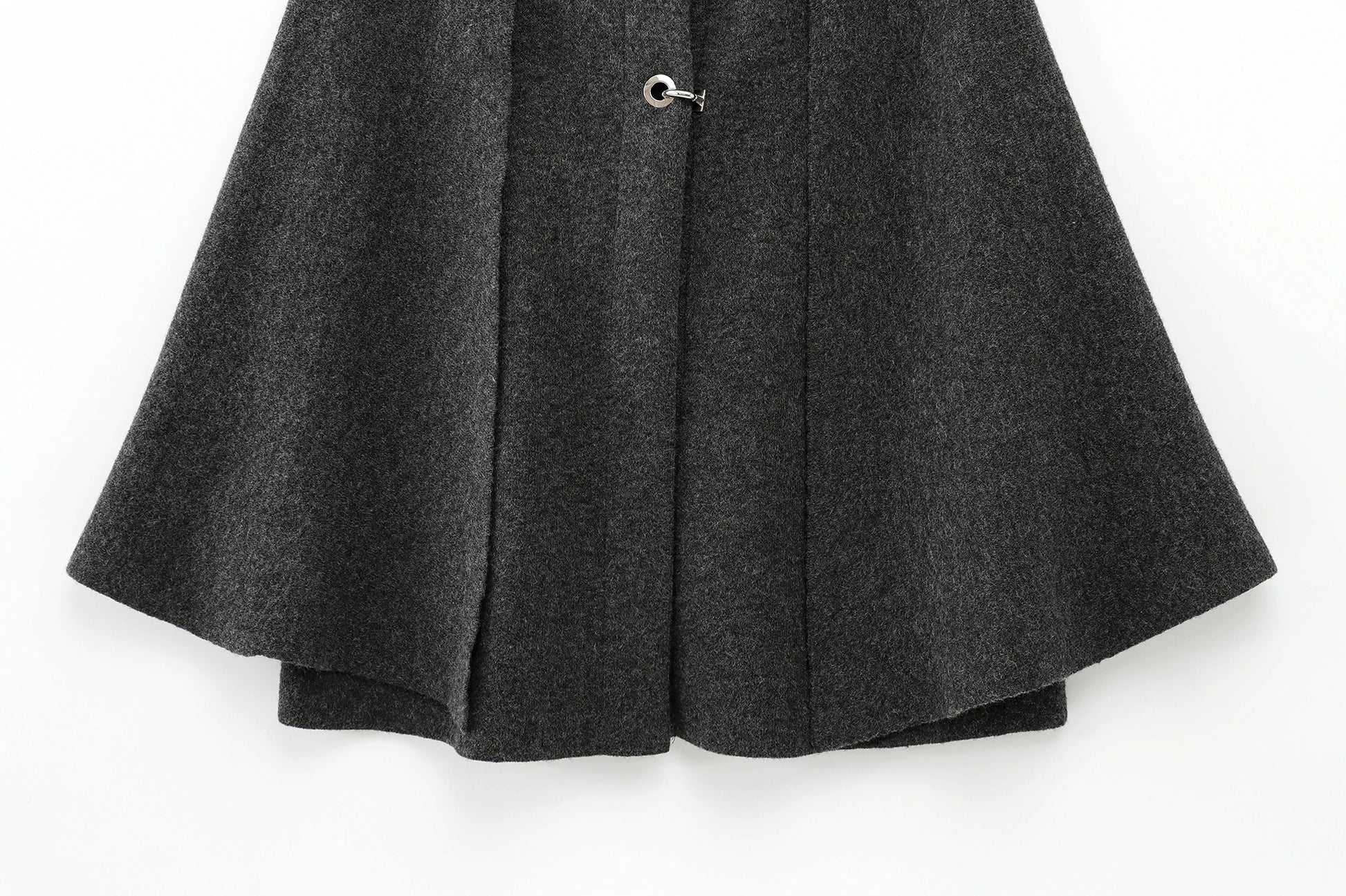 Dark gray cape with a button on a white background