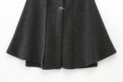 Dark gray cape with a button on a white background