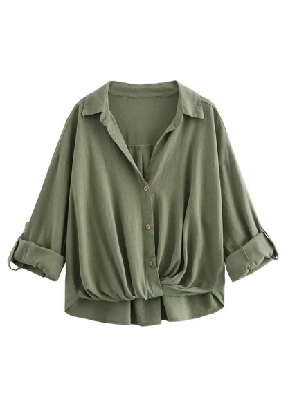Green button-up shirt with rolled-up sleeves on a white background