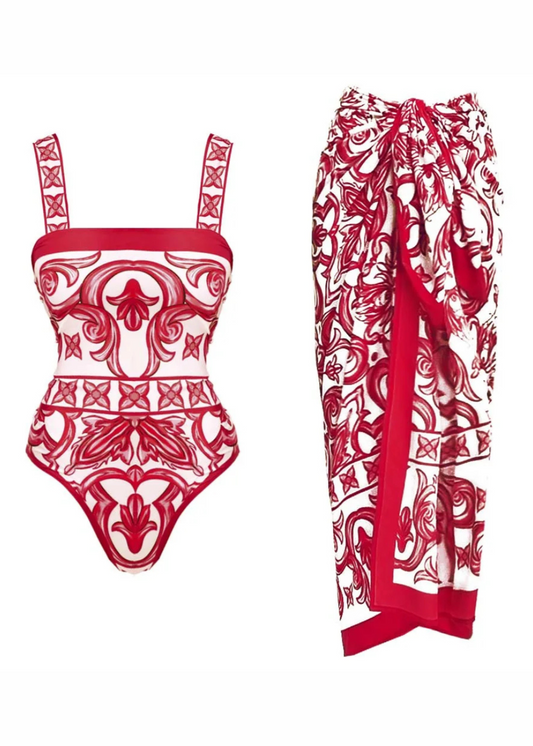 Red and white patterned swimsuit and sarong on a white background